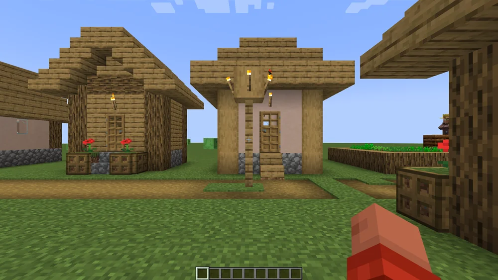 Returning to the village with /home: the player stands in front of their house again