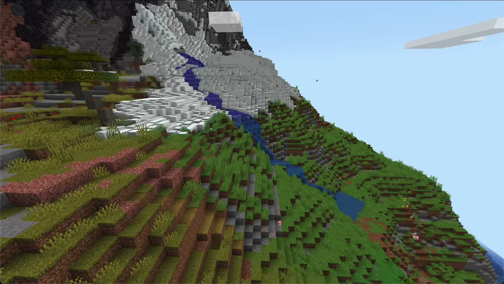 Terralith mountain world with a river and snow